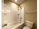 The bathroom features a tub and shower combination with a toilet and towel rack at 2865 Running Brook Cir, Kissimmee, FL 34744