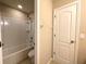 Bright bathroom features a shower-tub combo with updated fixtures and a convenient toilet at 2865 Running Brook Cir, Kissimmee, FL 34744