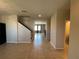 Bright foyer featuring neutral walls, tile flooring, and an open view of the living spaces at 2865 Running Brook Cir, Kissimmee, FL 34744