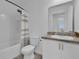 Bathroom with white cabinets, toilet, shower, and sink at 3039 Springwell Loop, Orlando, FL 32808