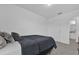 Bedroom with white walls, carpeted floors, and a comfortable bed at 3039 Springwell Loop, Orlando, FL 32808