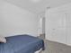Bright bedroom featuring neutral walls, carpeted floor, closet, and comfortable bed at 3039 Springwell Loop, Orlando, FL 32808