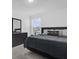 Bedroom with a large dresser, window, ceiling fan, and comfortable bed at 3039 Springwell Loop, Orlando, FL 32808