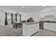 Well-lit kitchen open to dining area, featuring granite countertops and stainless appliances at 3039 Springwell Loop, Orlando, FL 32808