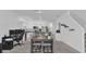 Bright living area with modern furnishings flowing into the kitchen and dining space at 3039 Springwell Loop, Orlando, FL 32808