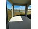 Relaxing back patio overlooking a serene pond and green space at 34071 Sky Blossom Cir, Leesburg, FL 34788