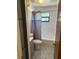 The bathroom features a toilet and shower-tub combo with tile surround at 35 Aberdeen Cir, Leesburg, FL 34788