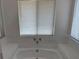 Enjoy the view from this jetted bathtub in the bathroom at 35 Aberdeen Cir, Leesburg, FL 34788