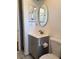 The bathroom features a pedestal sink and medicine cabinet for convenient storage at 35 Aberdeen Cir, Leesburg, FL 34788
