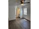 This bedroom features hardwood floors and a modern ceiling fan fixture at 35 Aberdeen Cir, Leesburg, FL 34788