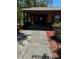 Exterior view of the home's carport, offering covered parking at 35 Aberdeen Cir, Leesburg, FL 34788