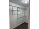 Walk-in closet with metal shelving and ample storage space at 35 Aberdeen Cir, Leesburg, FL 34788