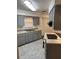 The kitchen is equipped with modern appliances, ample counter space, and light gray cabinets at 35 Aberdeen Cir, Leesburg, FL 34788