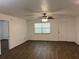 The living room is bright and airy with hard wood flooring and a ceiling fan at 35 Aberdeen Cir, Leesburg, FL 34788