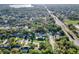 Beautiful aerial view of the property nestled in a lush, green neighborhood with mature trees and a private pool at 3517 Merivale Dr, Casselberry, FL 32707