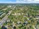 High angle aerial captures a vibrant residential area with lush greenery and easy access to thoroughfares at 3517 Merivale Dr, Casselberry, FL 32707