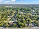 Wide aerial perspective featuring a quiet, tree-lined residential area with convenient access to main roads at 3517 Merivale Dr, Casselberry, FL 32707