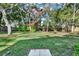 Lush backyard showcasing mature trees and greenery, offering a private and serene outdoor space at 3517 Merivale Dr, Casselberry, FL 32707