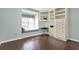Charming bedroom featuring built-in shelving, window seat, and patterned flooring at 3517 Merivale Dr, Casselberry, FL 32707