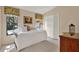 Bright bedroom with floral curtains, white bed, and closet at 3517 Merivale Dr, Casselberry, FL 32707