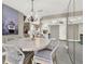 Open floor plan with a dining room that features a stylish chandelier and seating for six at 3517 Merivale Dr, Casselberry, FL 32707