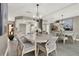 Dining room with decorative lighting, stylish table for six, and tile flooring at 3517 Merivale Dr, Casselberry, FL 32707
