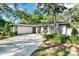 The front of a lovely home with a driveway and two-car garage at 3517 Merivale Dr, Casselberry, FL 32707