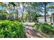 The front view of a home with a beautiful red brick pathway leading to it at 3517 Merivale Dr, Casselberry, FL 32707