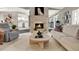 A living room with modern furniture, fireplace and an open view into the kitchen at 3517 Merivale Dr, Casselberry, FL 32707