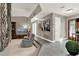 Bright living area with a wood cabinet, entertainment center, recliner, and view into the entry at 3517 Merivale Dr, Casselberry, FL 32707