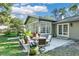 Inviting outdoor patio with comfortable seating and lush greenery, ideal for relaxation and entertaining guests at 3517 Merivale Dr, Casselberry, FL 32707