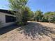 Private backyard with lush trees, offering privacy and natural beauty, and complementing the house's exterior at 361 Tulip Trl, Casselberry, FL 32707