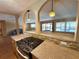 Spacious open kitchen with granite countertops, wood cabinets, and a gas cooktop offering clear views of the living area at 361 Tulip Trl, Casselberry, FL 32707