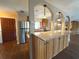 Modern open kitchen featuring granite countertops and stainless steel appliances with a seamless view into the main living area at 361 Tulip Trl, Casselberry, FL 32707