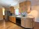Functional kitchen with wood cabinets, granite countertops, and stainless steel appliances, ideal for cooking and entertaining at 361 Tulip Trl, Casselberry, FL 32707