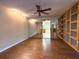 Stylish living room featuring hardwood floors and a mirrored wall at 361 Tulip Trl, Casselberry, FL 32707