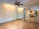 Stylish living room featuring hardwood floors and a mirrored wall at 361 Tulip Trl, Casselberry, FL 32707