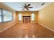 Open concept living room with a fireplace and hardwood floors at 361 Tulip Trl, Casselberry, FL 32707