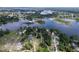 Panoramic aerial view of a lakeside neighborhood with lush greenery, showcasing a peaceful and picturesque community at 407 Sheryl Dr, Deltona, FL 32738