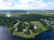 Picturesque aerial view showcasing a lakeside home with lush greenery and the tranquil beauty of the surrounding landscape at 407 Sheryl Dr, Deltona, FL 32738