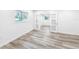 Bright bedroom with wood-look flooring and modern doors at 407 Sheryl Dr, Deltona, FL 32738