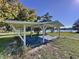 Outdoor carport with a nice view of the lake, perfect for parking or relaxing at 407 Sheryl Dr, Deltona, FL 32738