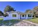 Well maintained home with a modern exterior, manicured grass, and a clear blue sky at 407 Sheryl Dr, Deltona, FL 32738
