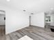 Expansive living room featuring sleek floors, neutral paint, and multiple entryways at 407 Sheryl Dr, Deltona, FL 32738