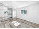 Spacious main bedroom featuring modern closet, hardwood floors, and bright natural light at 407 Sheryl Dr, Deltona, FL 32738