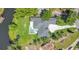 An aerial view features a pool and a manicured backyard at 4210 Waterfront Pkwy, Orlando, FL 32806