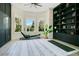 Bright exercise room with large windows, modern exercise equipment, and built-in shelving for storage at 4210 Waterfront Pkwy, Orlando, FL 32806