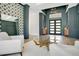 Stunning home foyer featuring modern decor, a unique table, and high ceilings at 4210 Waterfront Pkwy, Orlando, FL 32806