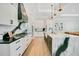 Gourmet kitchen with custom cabinets, marble countertops, and stainless steel appliances at 4210 Waterfront Pkwy, Orlando, FL 32806