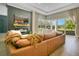 Bright and airy living room showcasing a modern fireplace and a view of the pool at 4210 Waterfront Pkwy, Orlando, FL 32806